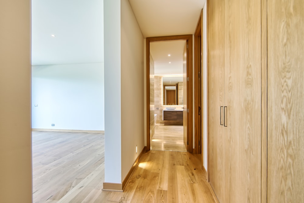 a hallway leading to a bedroom and a bathroom