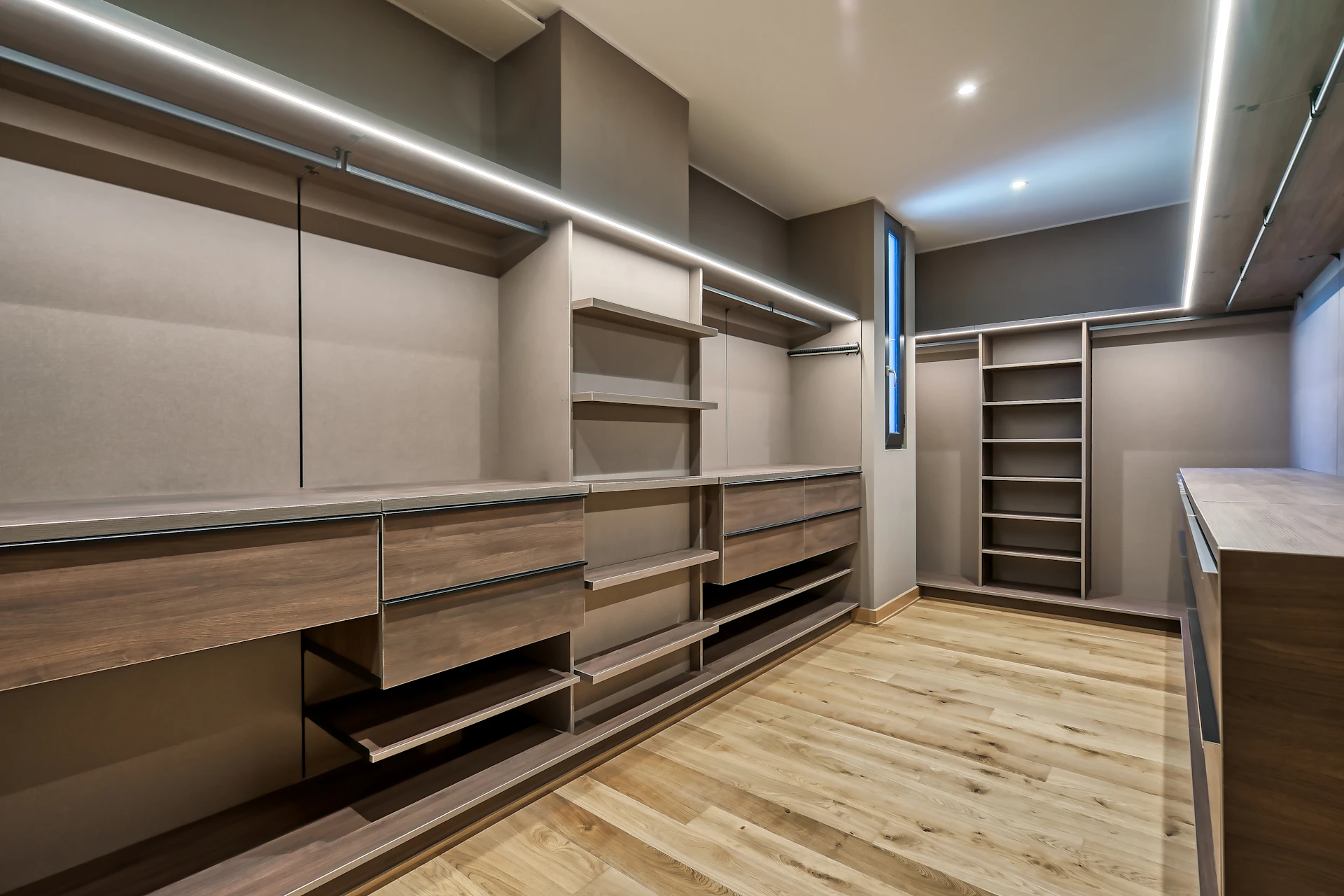 Custom walk-in closet with wooden shelving