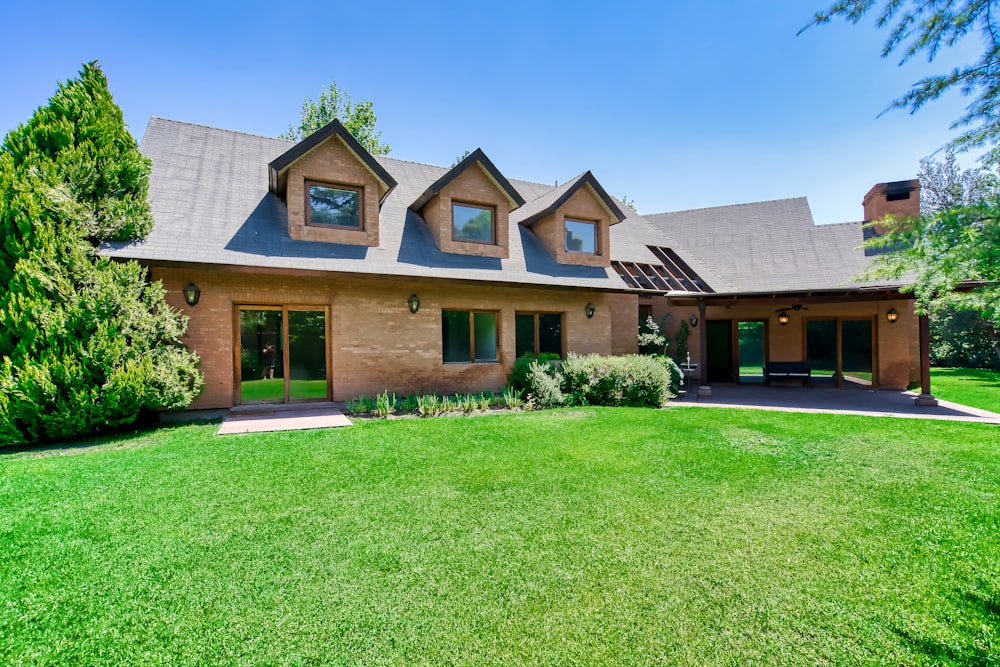 a house with a large lawn in front of it