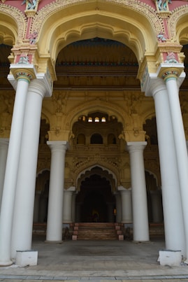 a large building with columns and a clock on the wall