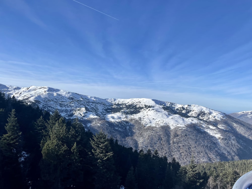 a view of a snowy mountain range from a ski slope