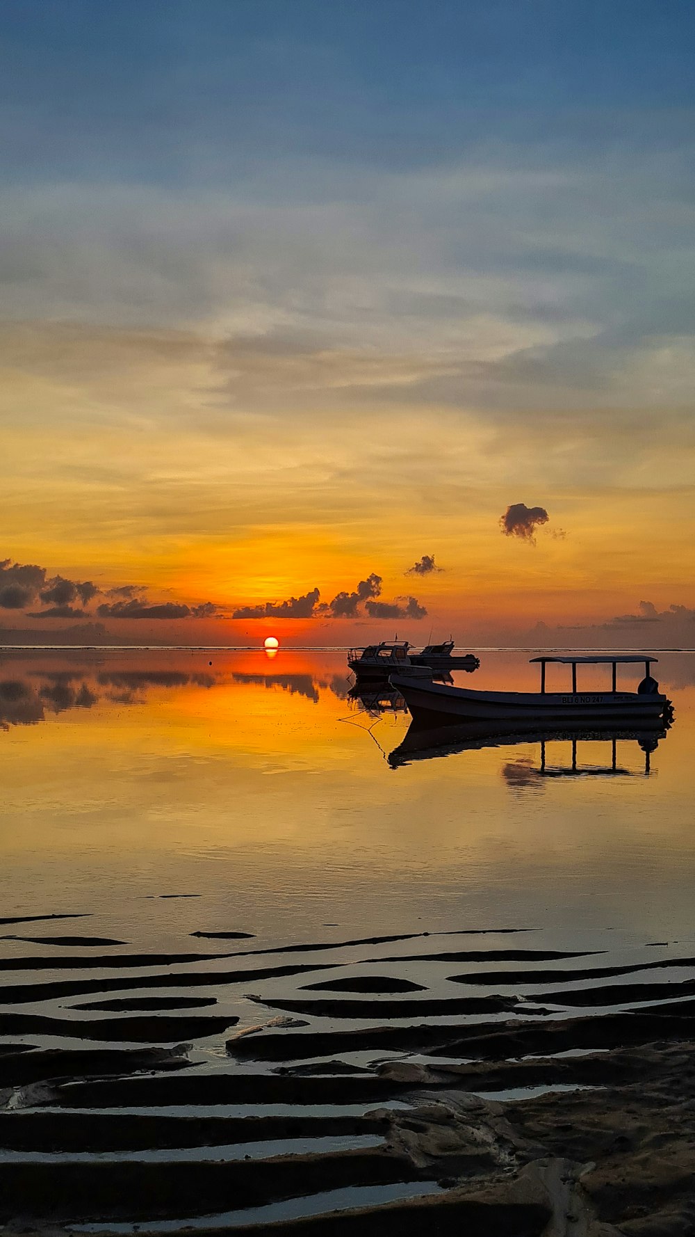 a boat sitting on top of a body of water