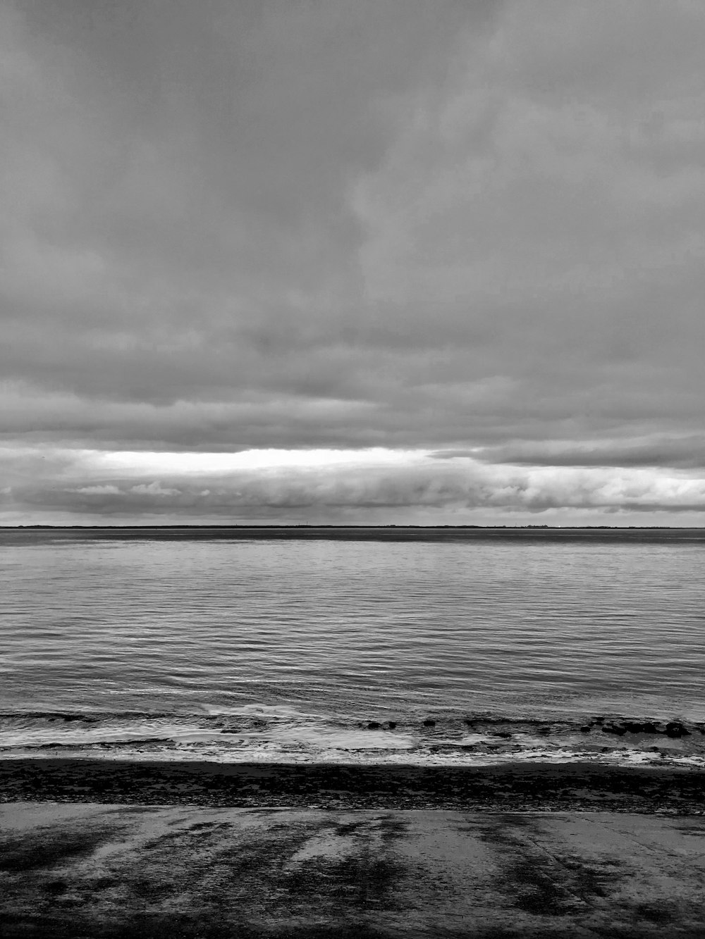 a black and white photo of a body of water