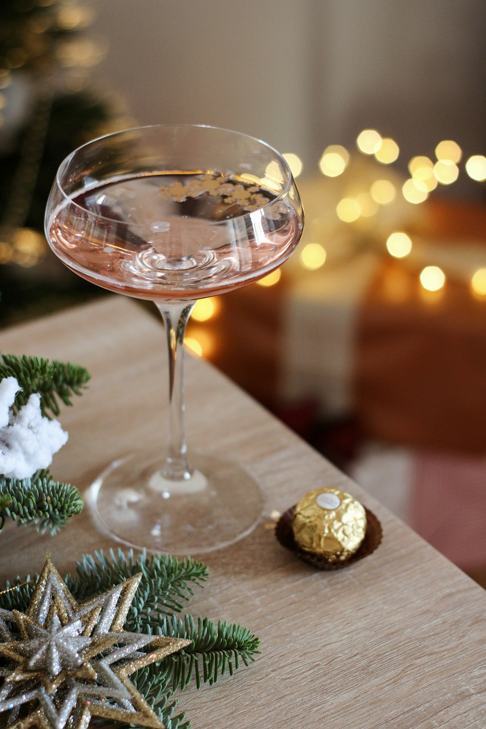 a close up of a wine glass on a table