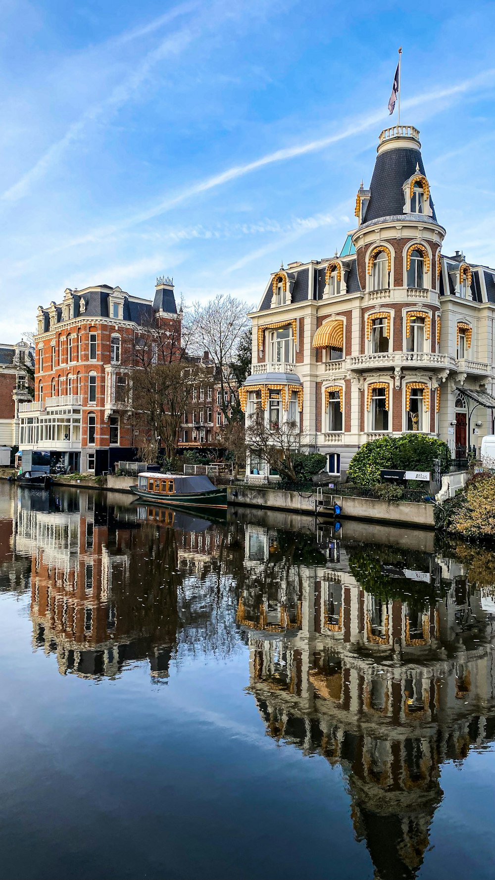 a large building sitting next to a body of water