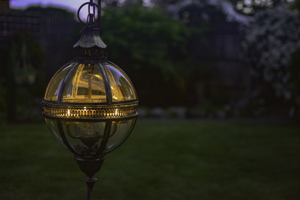 a light that is on a pole in the grass