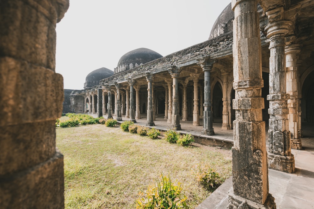 an old building with a lot of pillars and arches