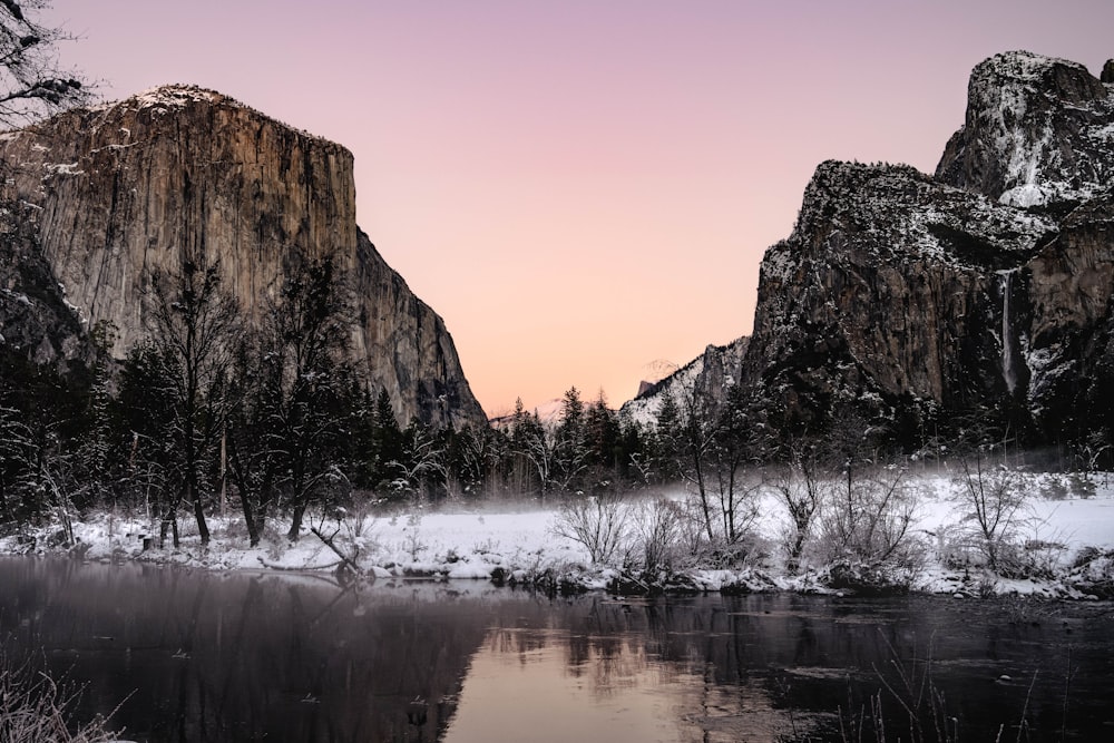 a body of water with a mountain in the background