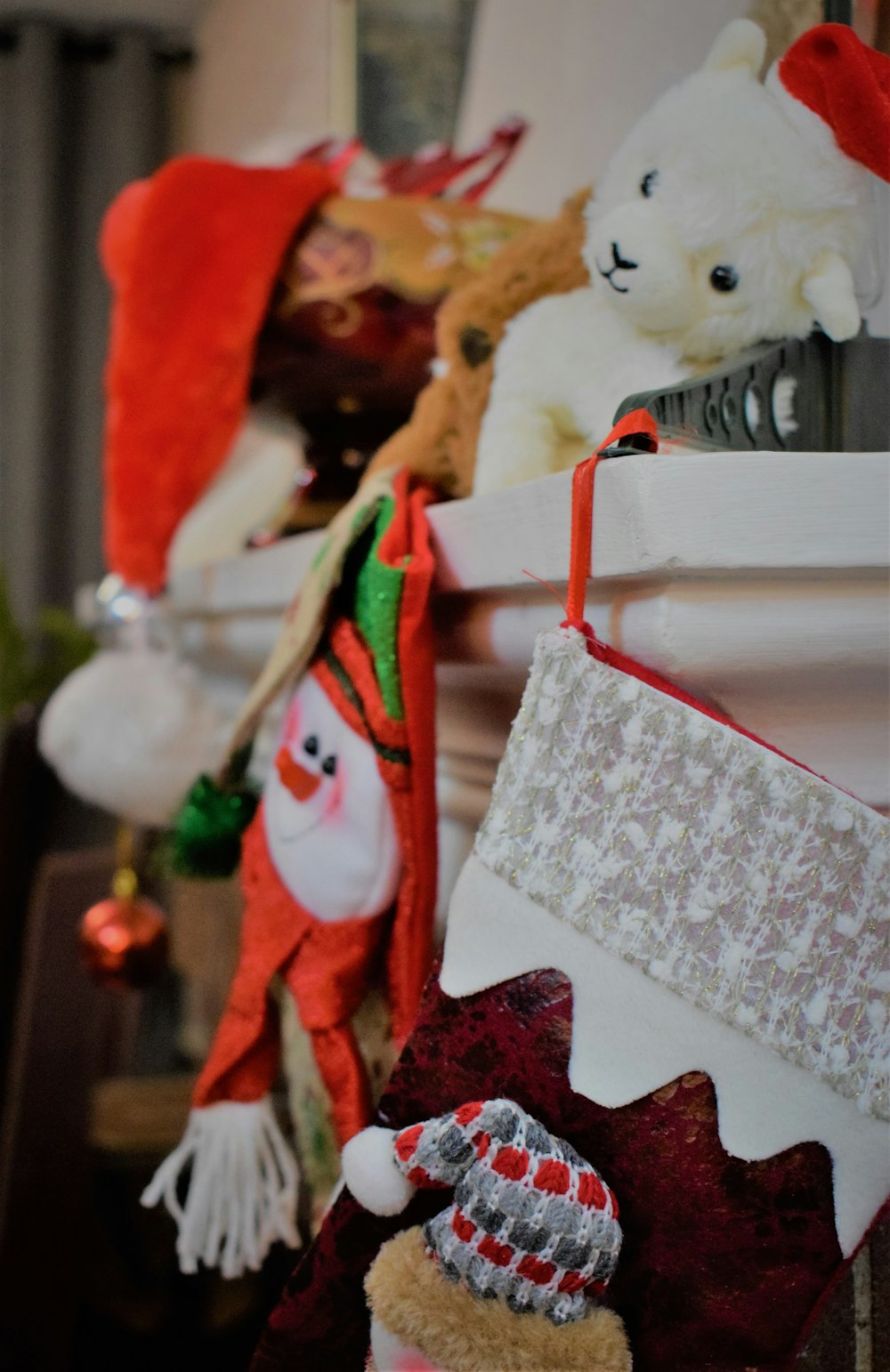 a group of stuffed animals hanging from a shelf