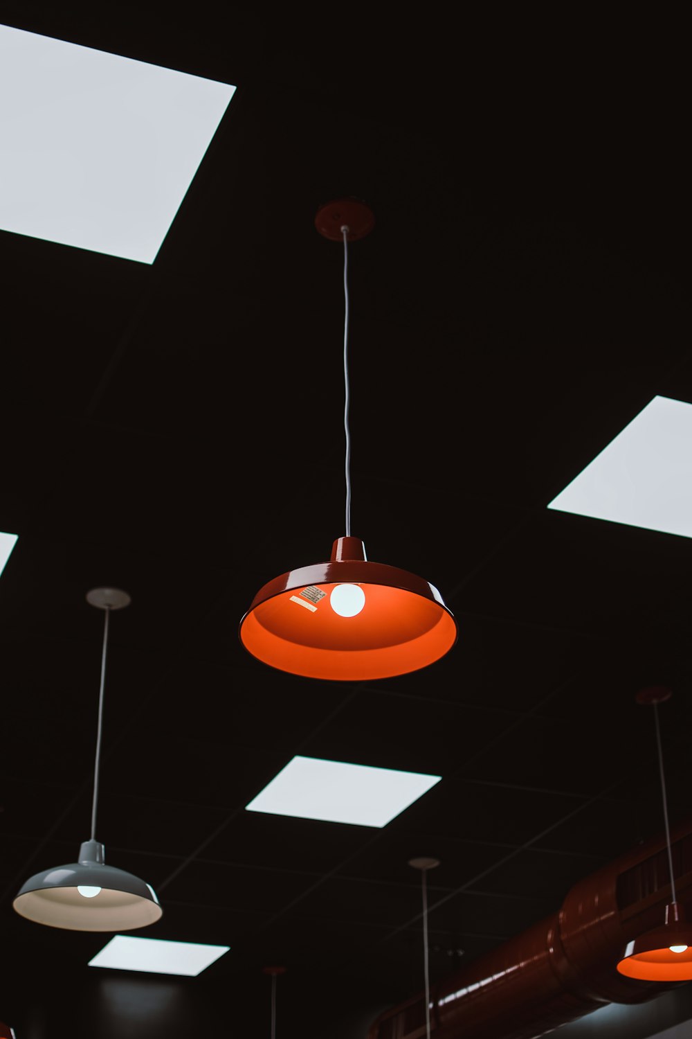 a group of lights hanging from the ceiling