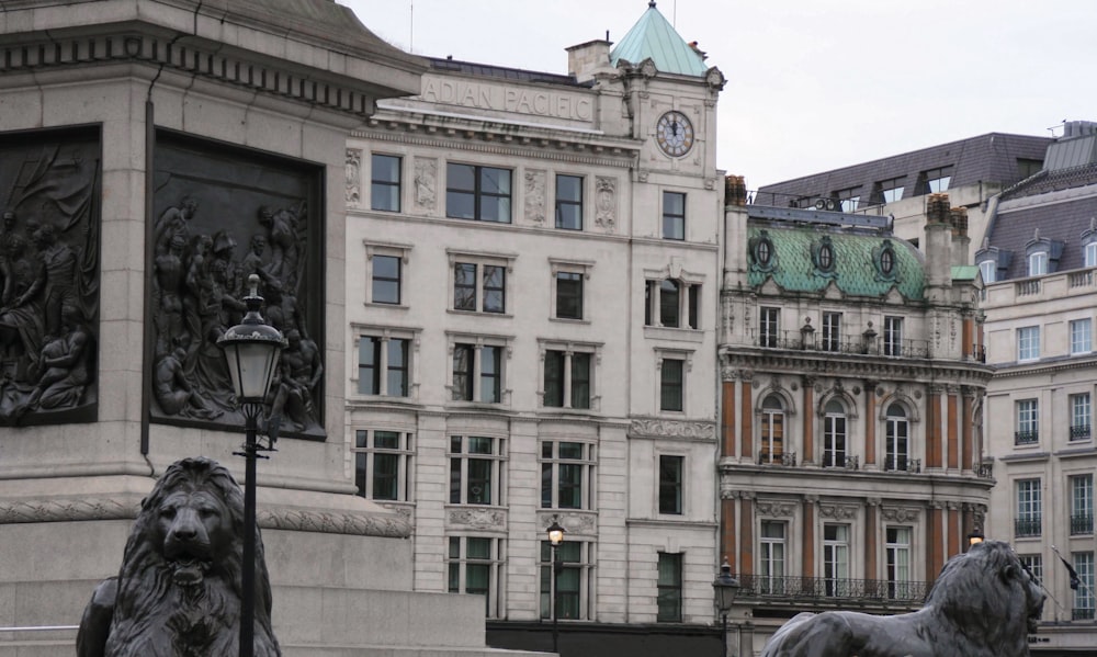 a statue of lions in front of a building