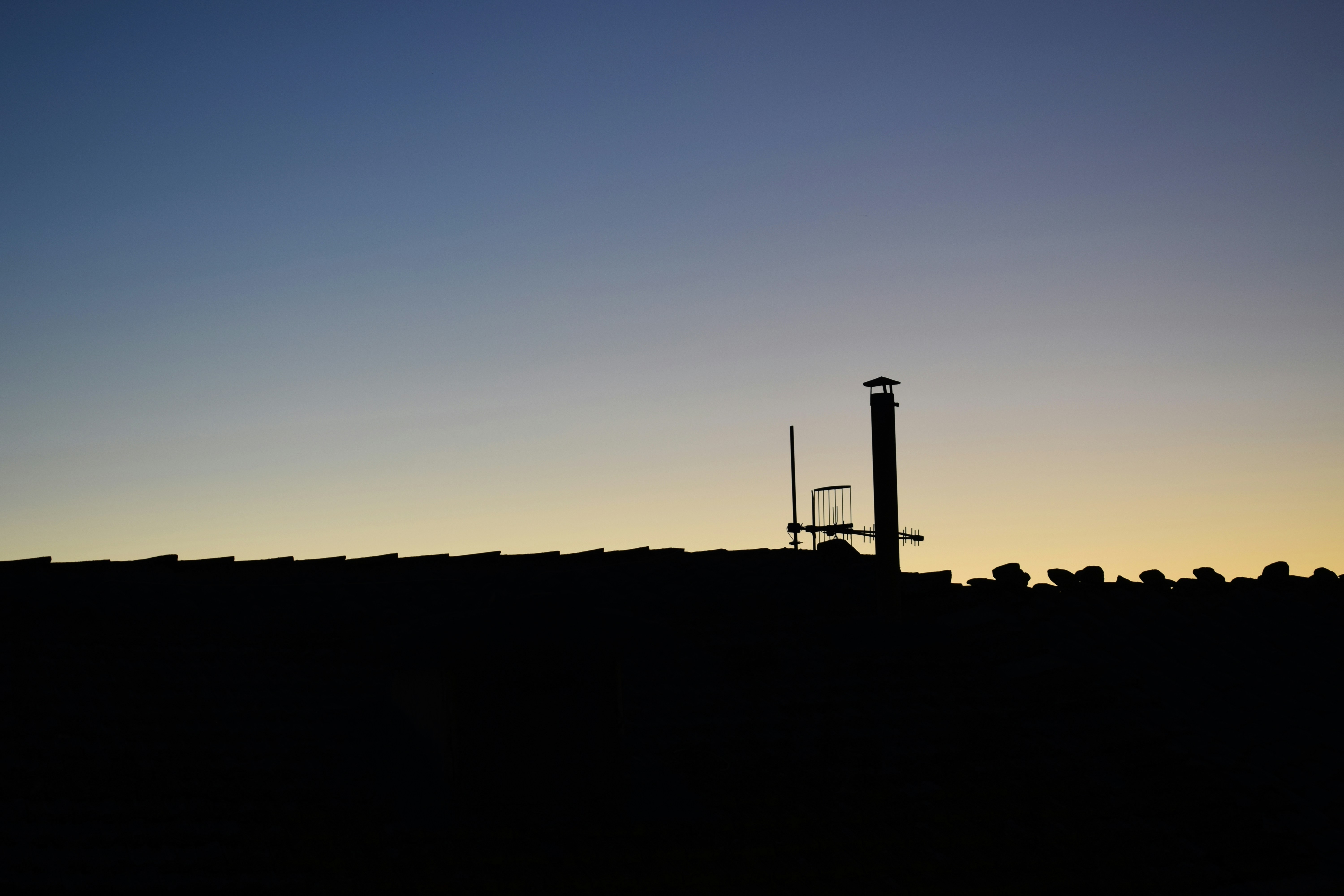 Aerial view of a large refinery complex at dusk.