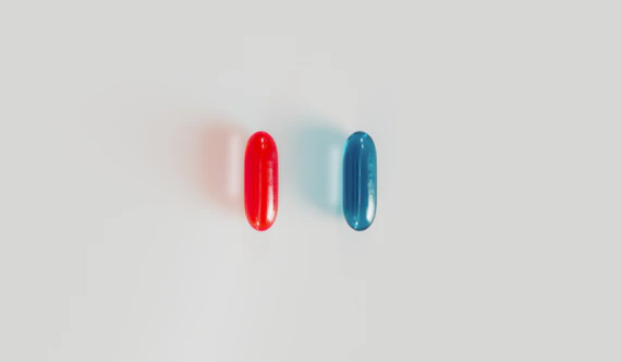 a pair of red and blue surfboards sitting next to each other