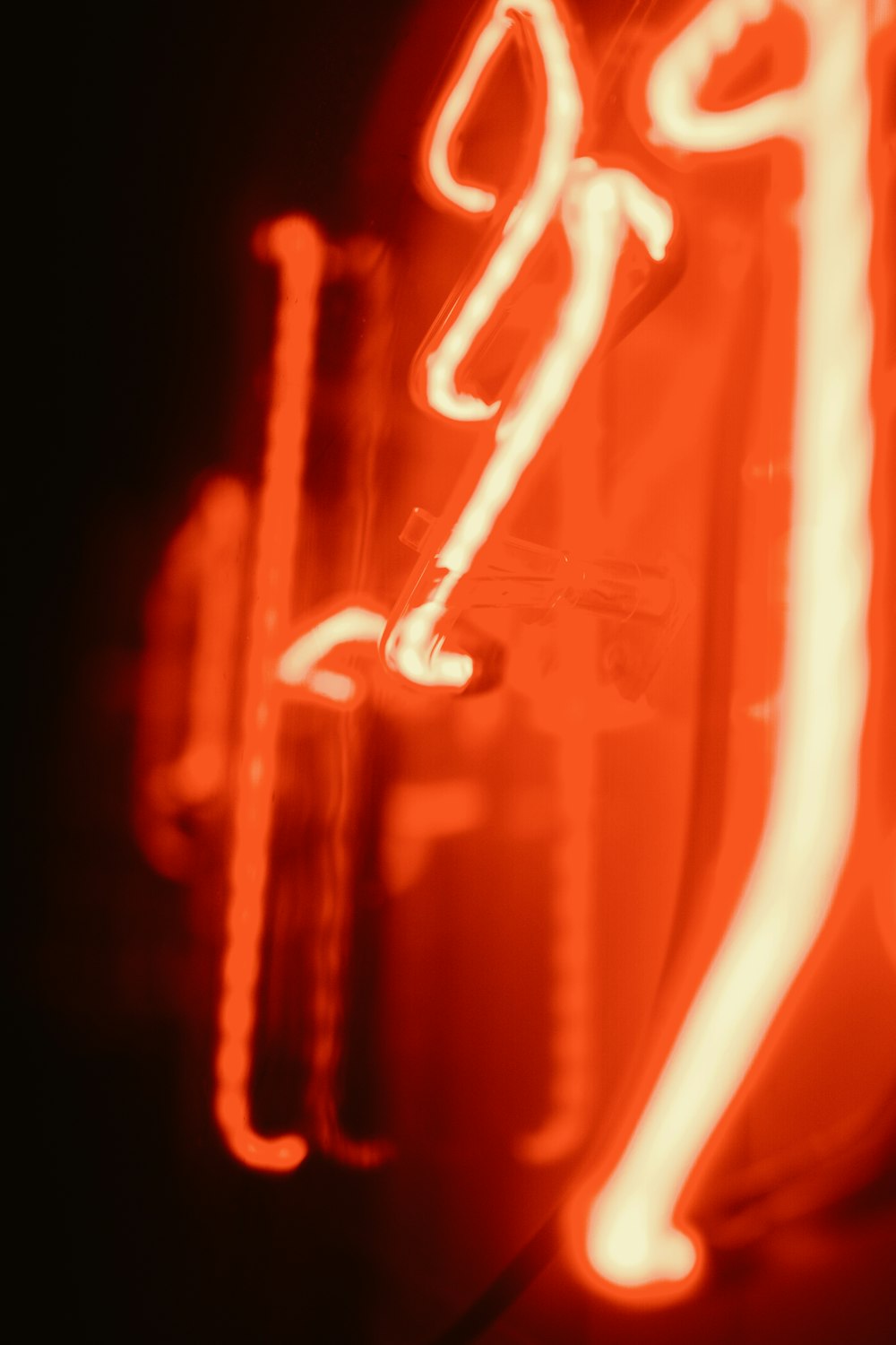 a close up of a neon sign on a building