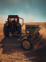 a tractor is plowing a field with dirt