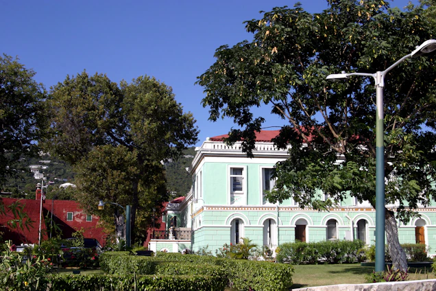 A sunlit historic building surrounded by oak trees in Conejo Valley.