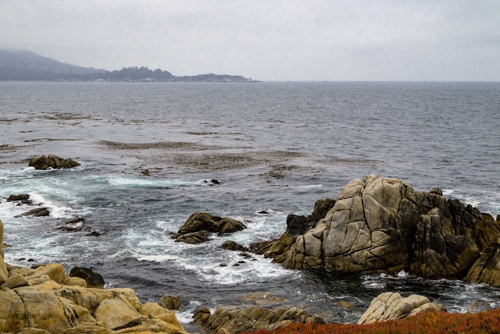 a large body of water surrounded by rocks