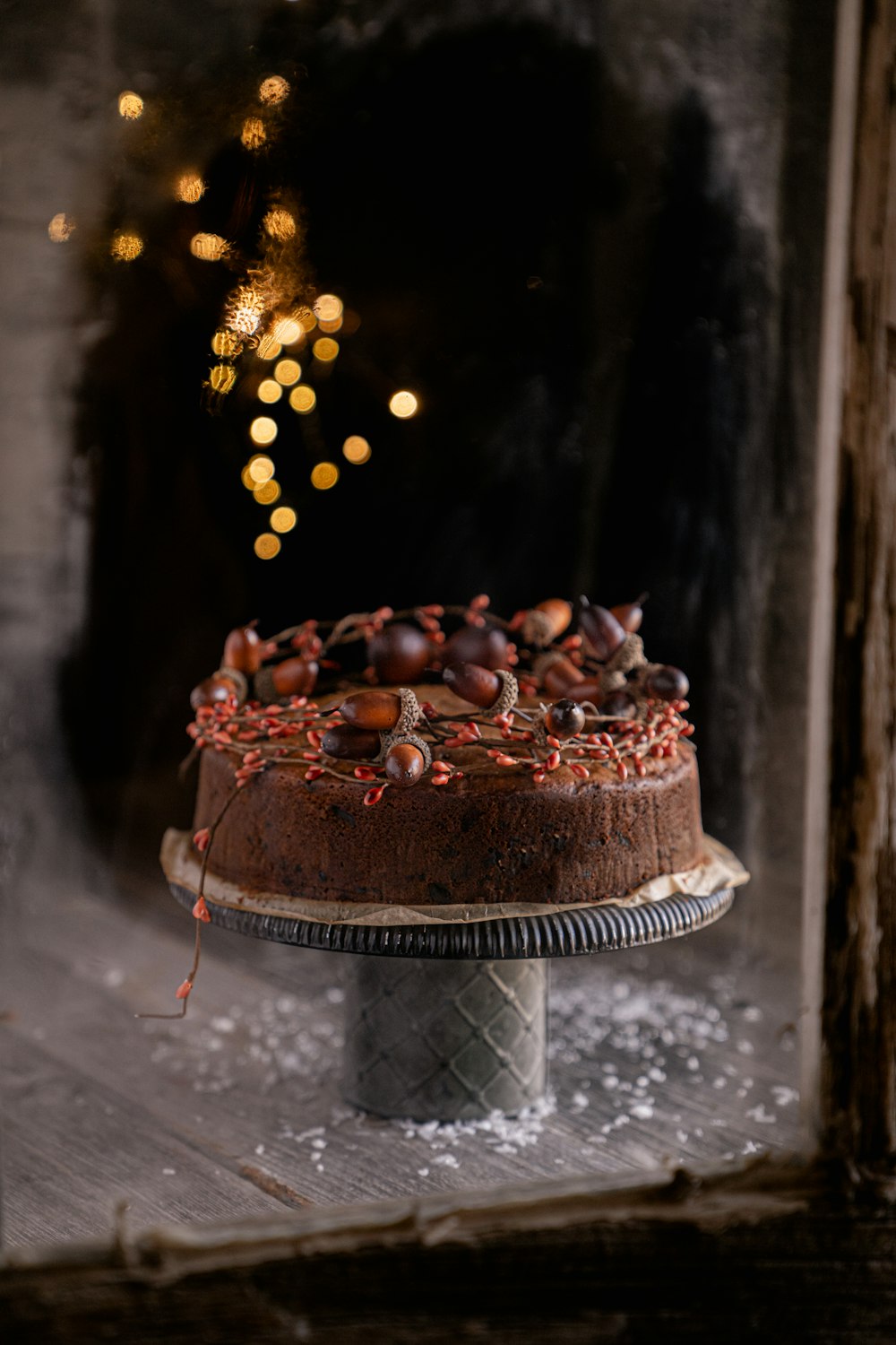 a chocolate cake sitting on top of a wooden table