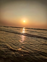 A tranquil scene of a sunset over a calm sea, symbolizing reflection.