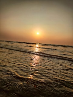 A tranquil scene of a sunset over a calm sea, symbolizing reflection.