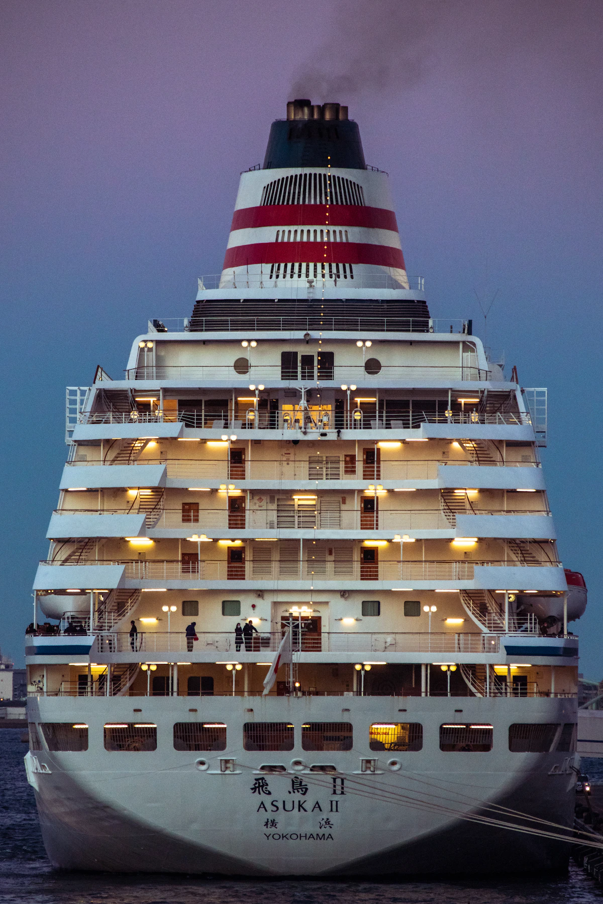 A large cruise ship on the water at night