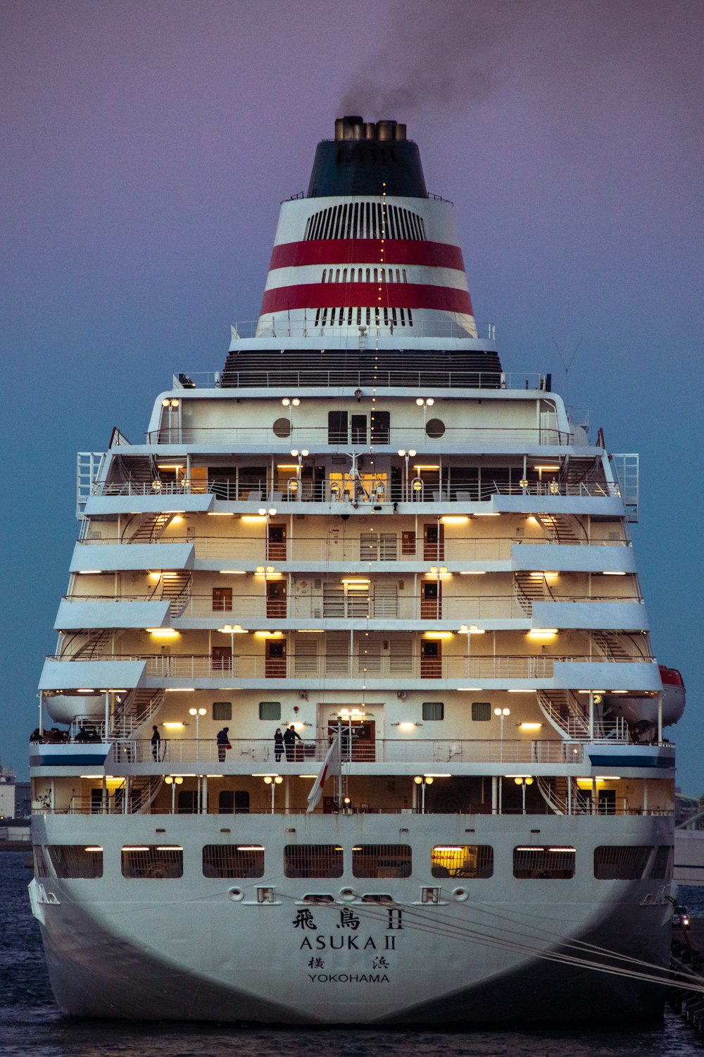 a large cruise ship in the water at night