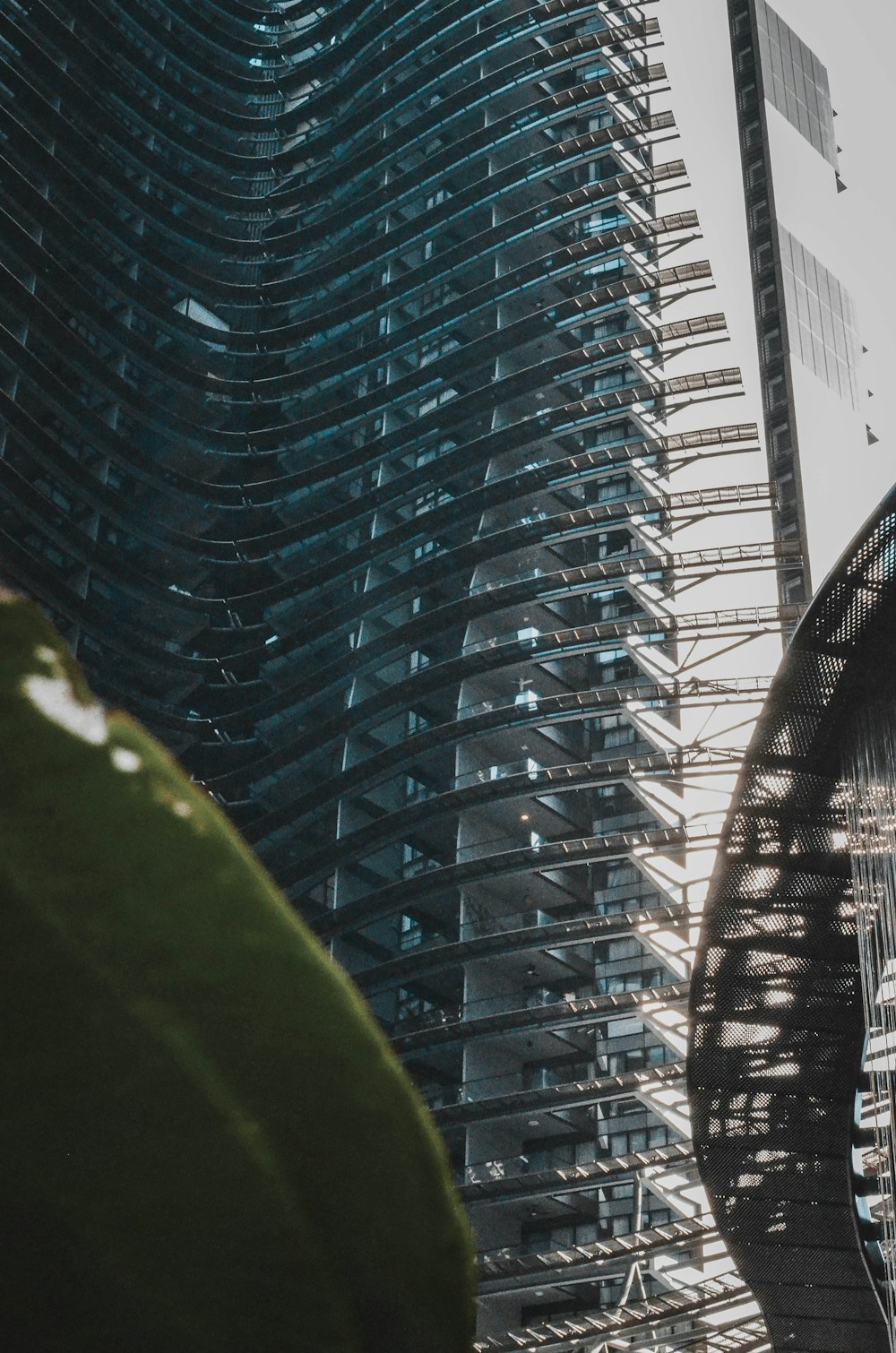 a tall building next to a very tall building