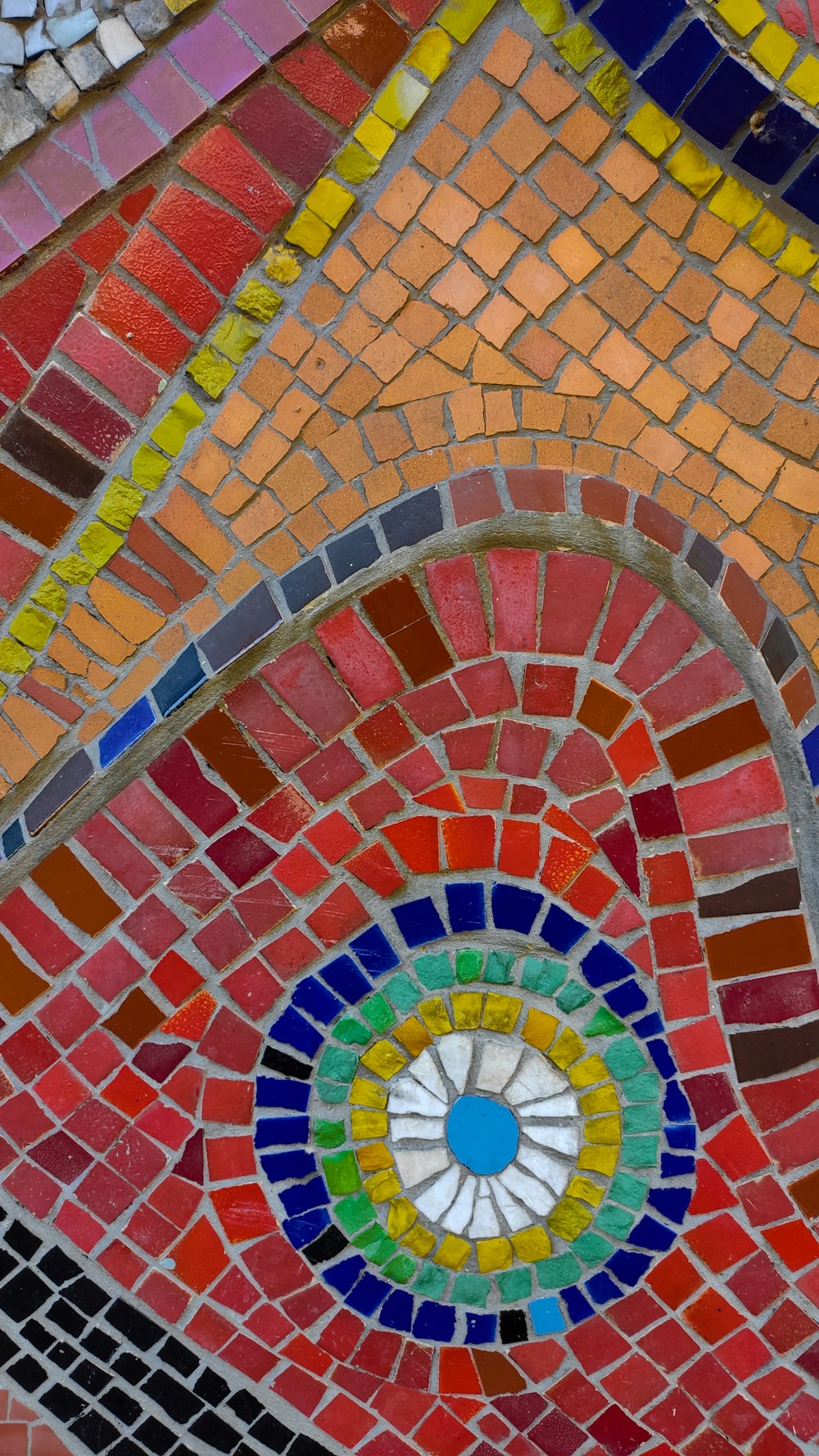 a close up of a multicolored mosaic design