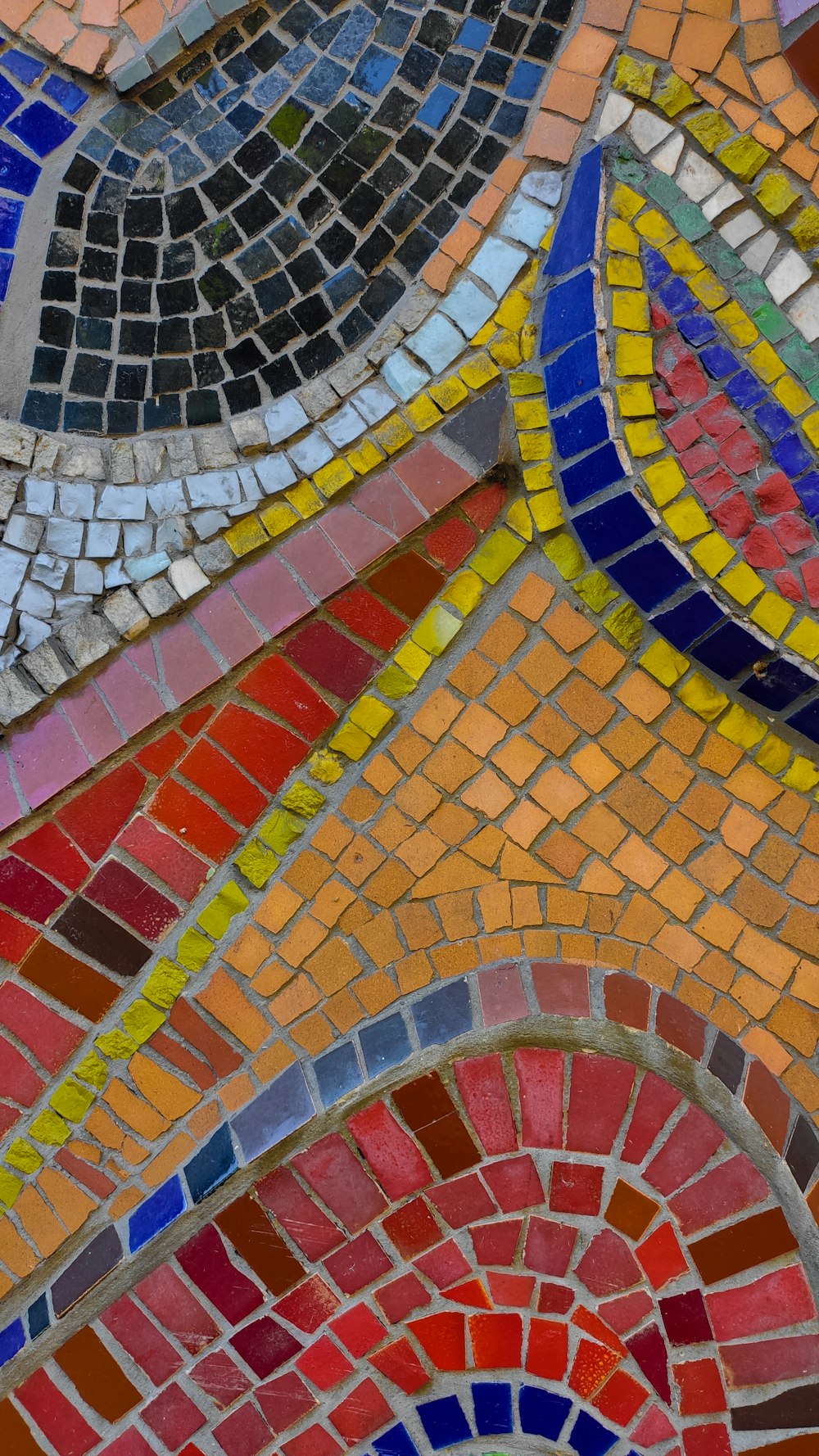 a close up of a colorful mosaic design