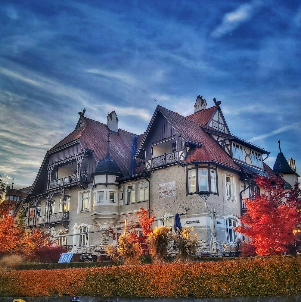 a large white house with a red roof