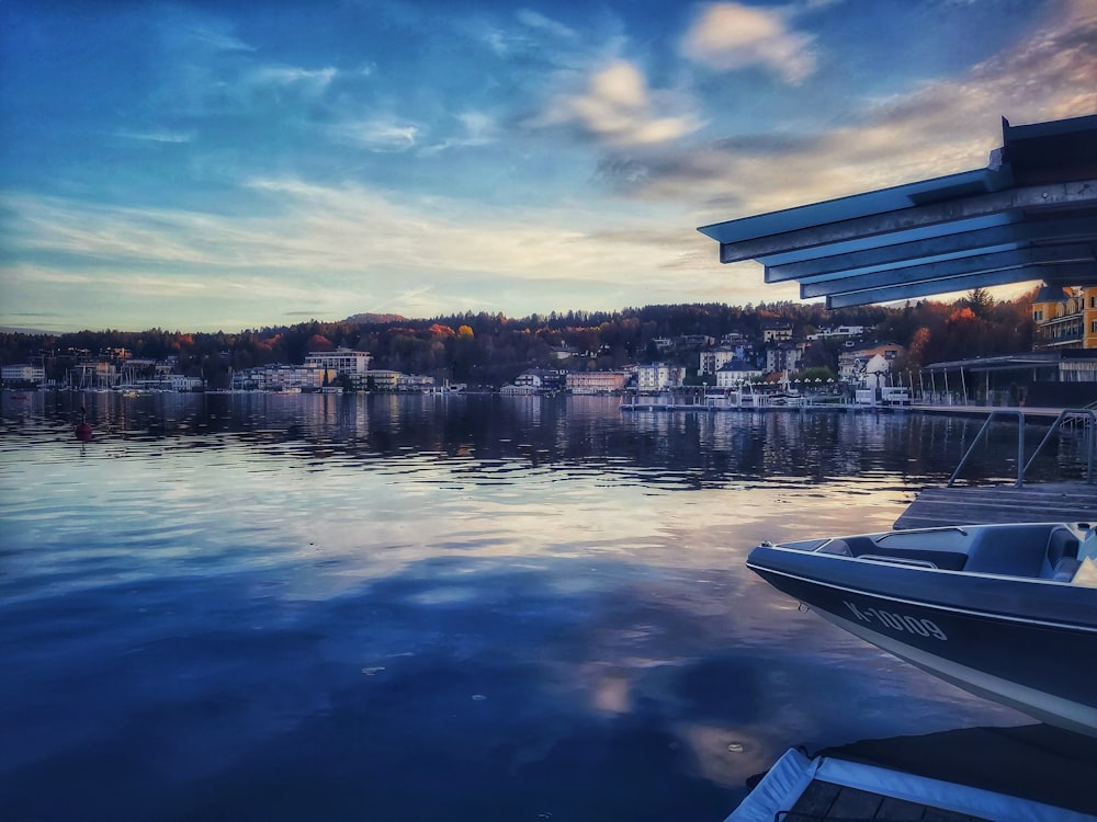 a boat is docked at a dock on a lake