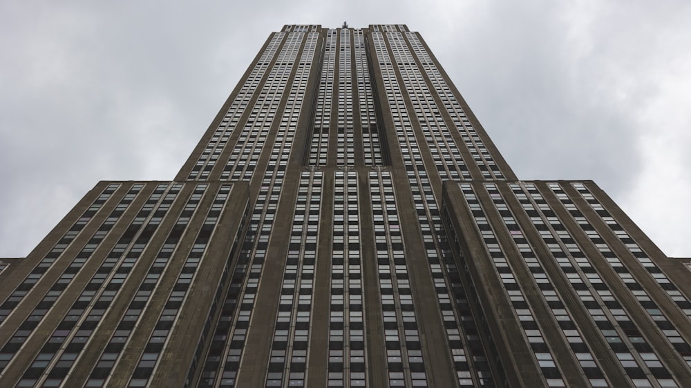 looking up at the top of a tall building