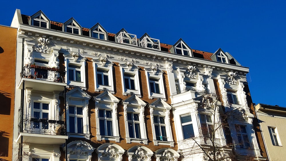 a tall building with many windows and balconies