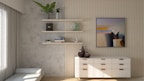 Sleek modern wall-mounted shelves holding books and decorative items in a bright living room.