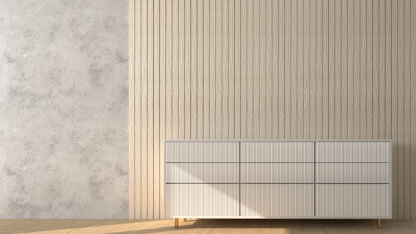 Modern minimalist room accented by a sleek, neutral-toned carpet from our collection.