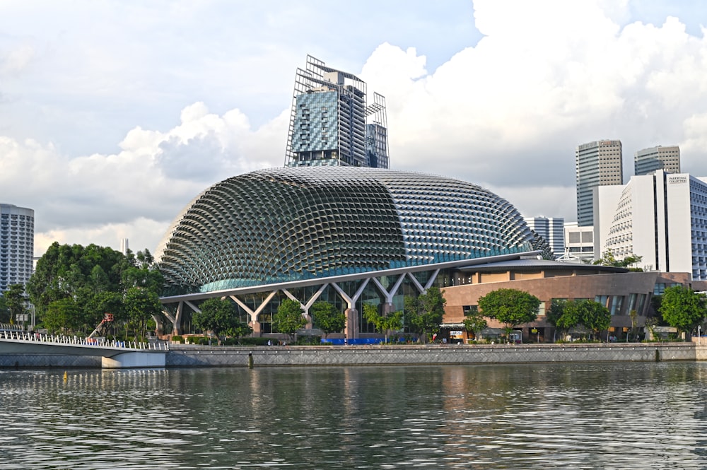 a large building sitting on the side of a river