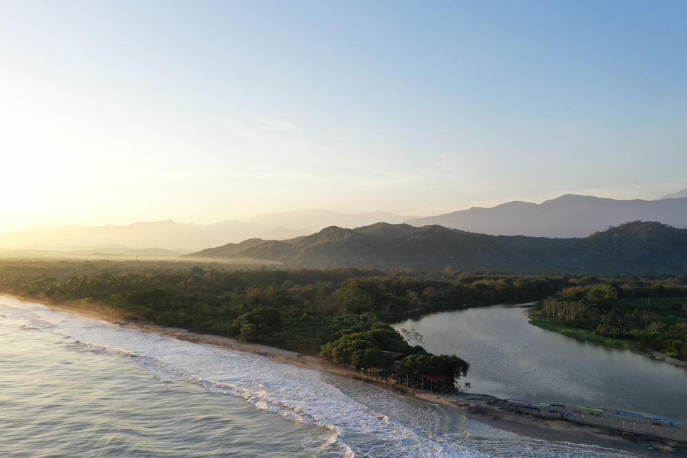 an aerial view of a body of water near a beach