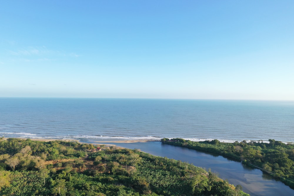 an aerial view of the ocean and land