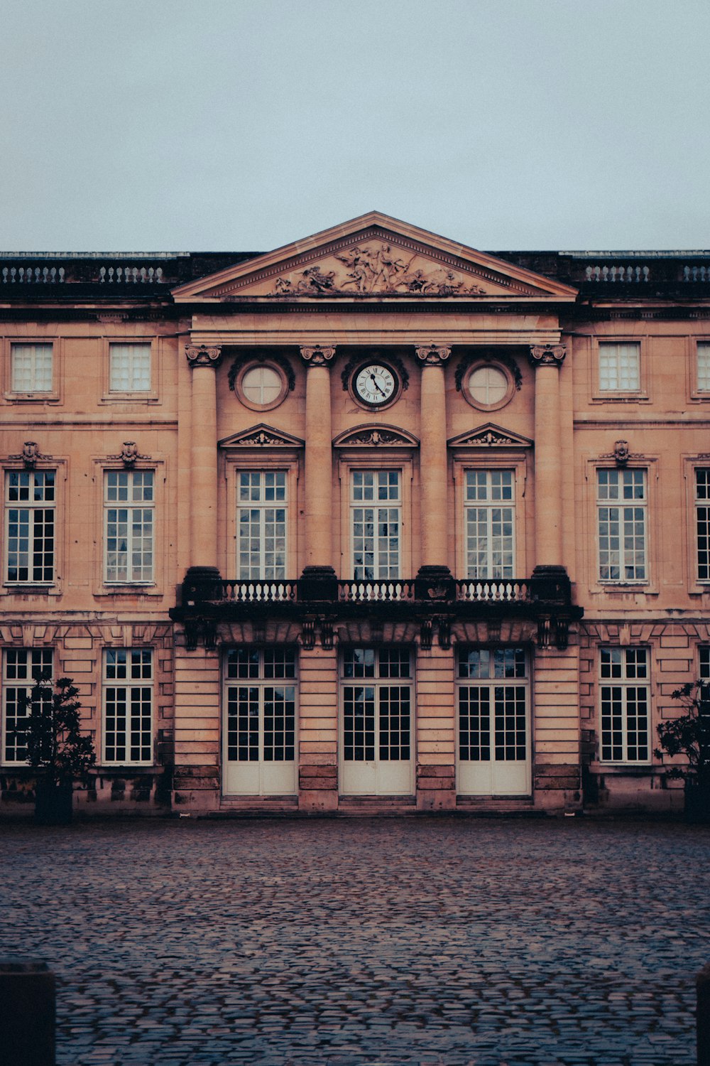 a large building with a clock on the front of it