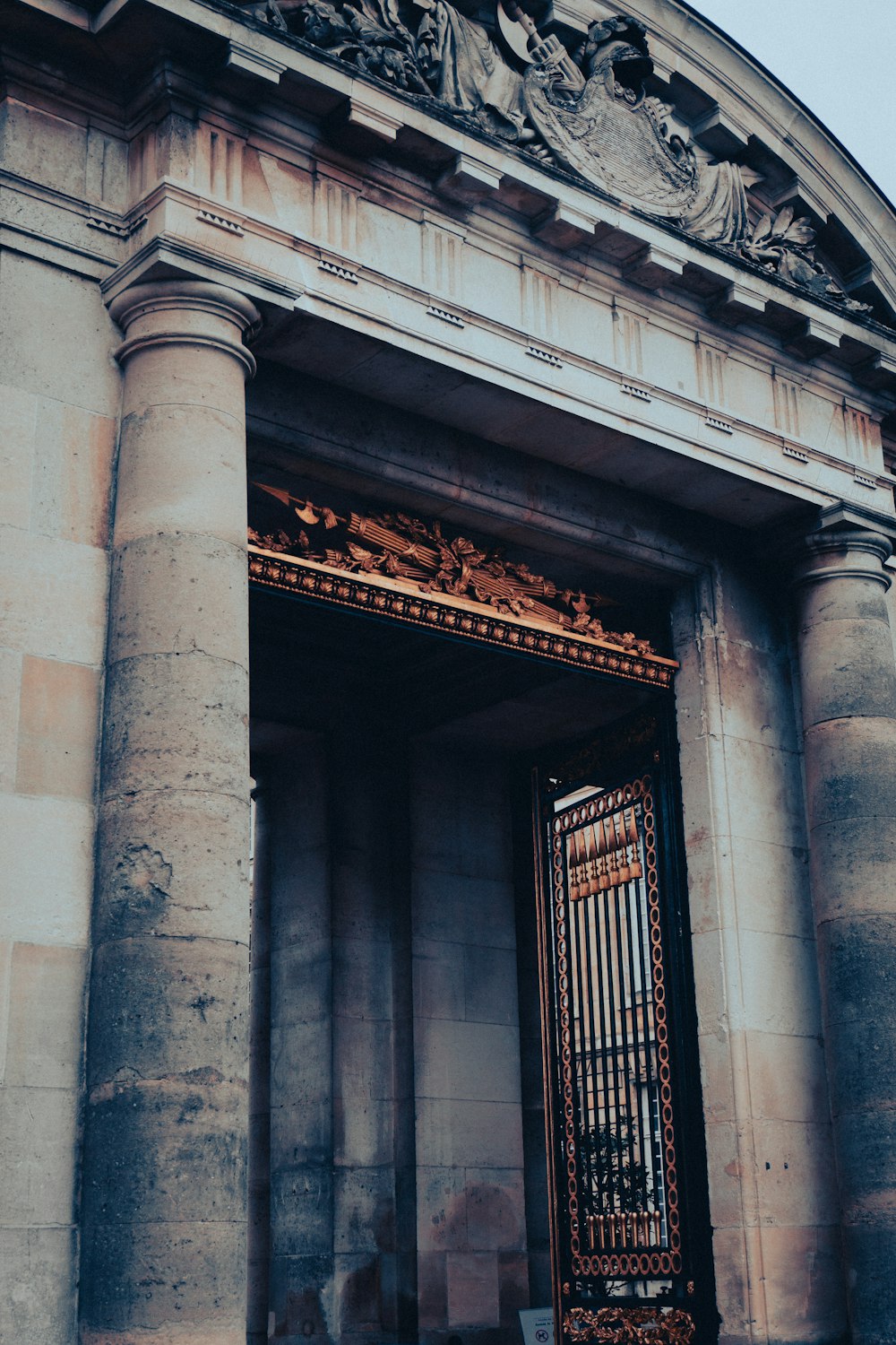 an old building with a large metal gate