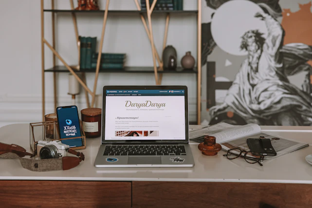 A serene workspace blending legal books, technology devices, artistic sketches, and astrological charts arranged harmoniously.