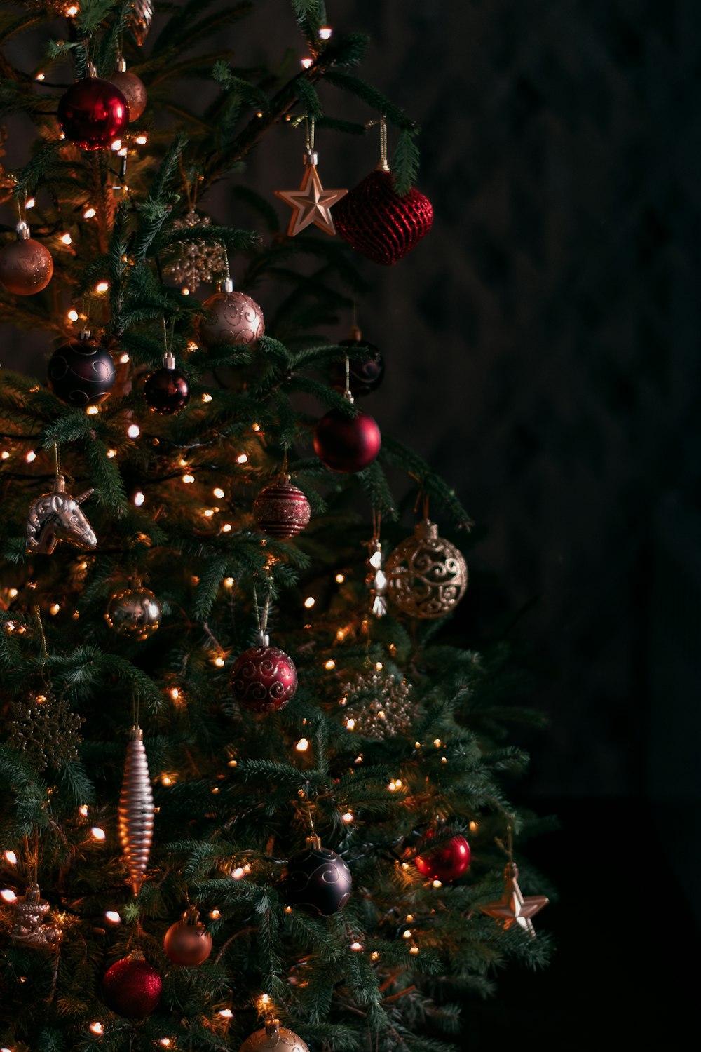 a small christmas tree with ornaments on it