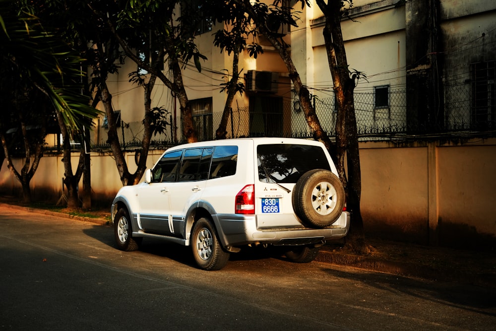 a white truck parked on the side of the road