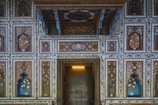 A detailed view of intricate Mughal-era floral patterns on palace walls.