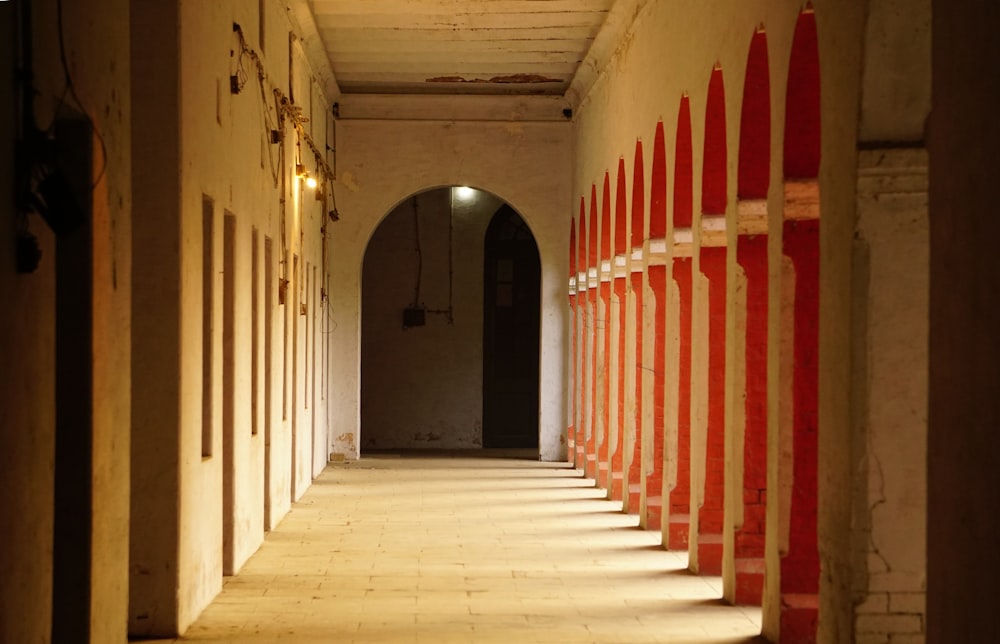 a long hallway with red and white striped walls