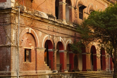 an old brick building with arches and arches