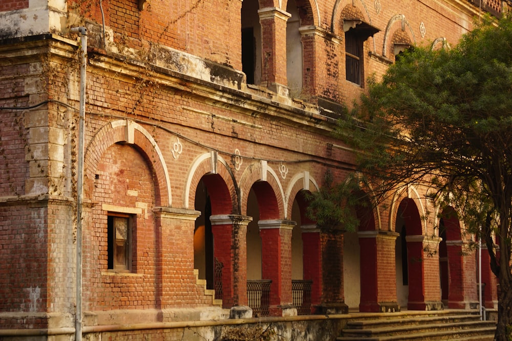 an old brick building with arches and arches