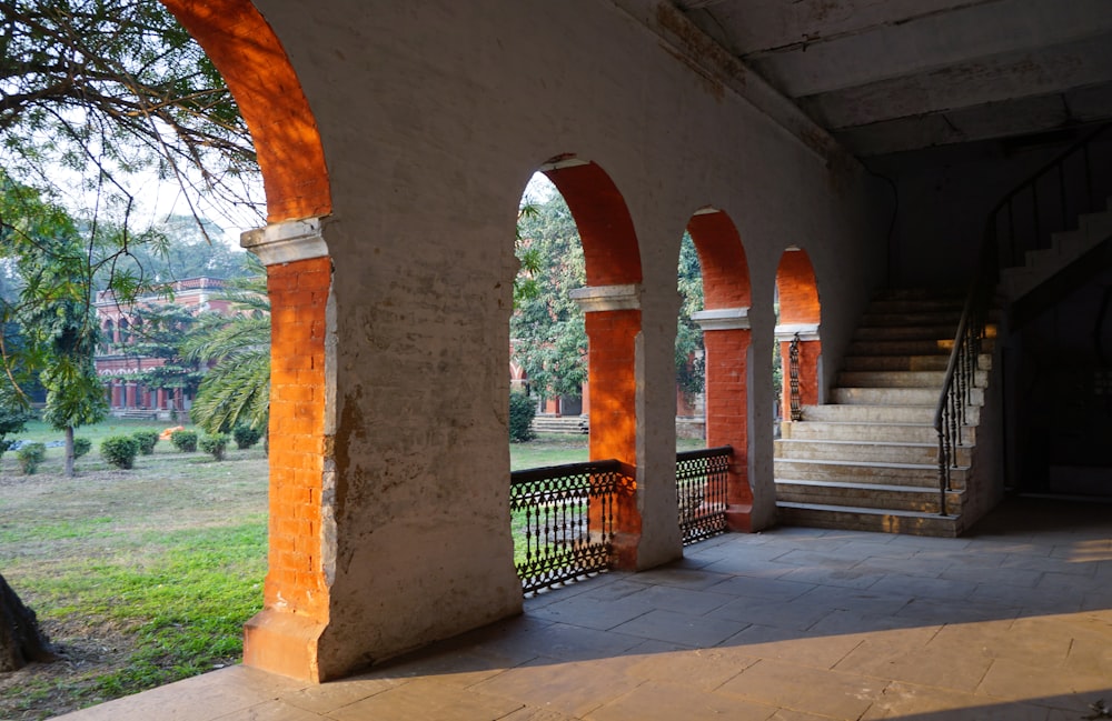 an outdoor area with arches and stairs
