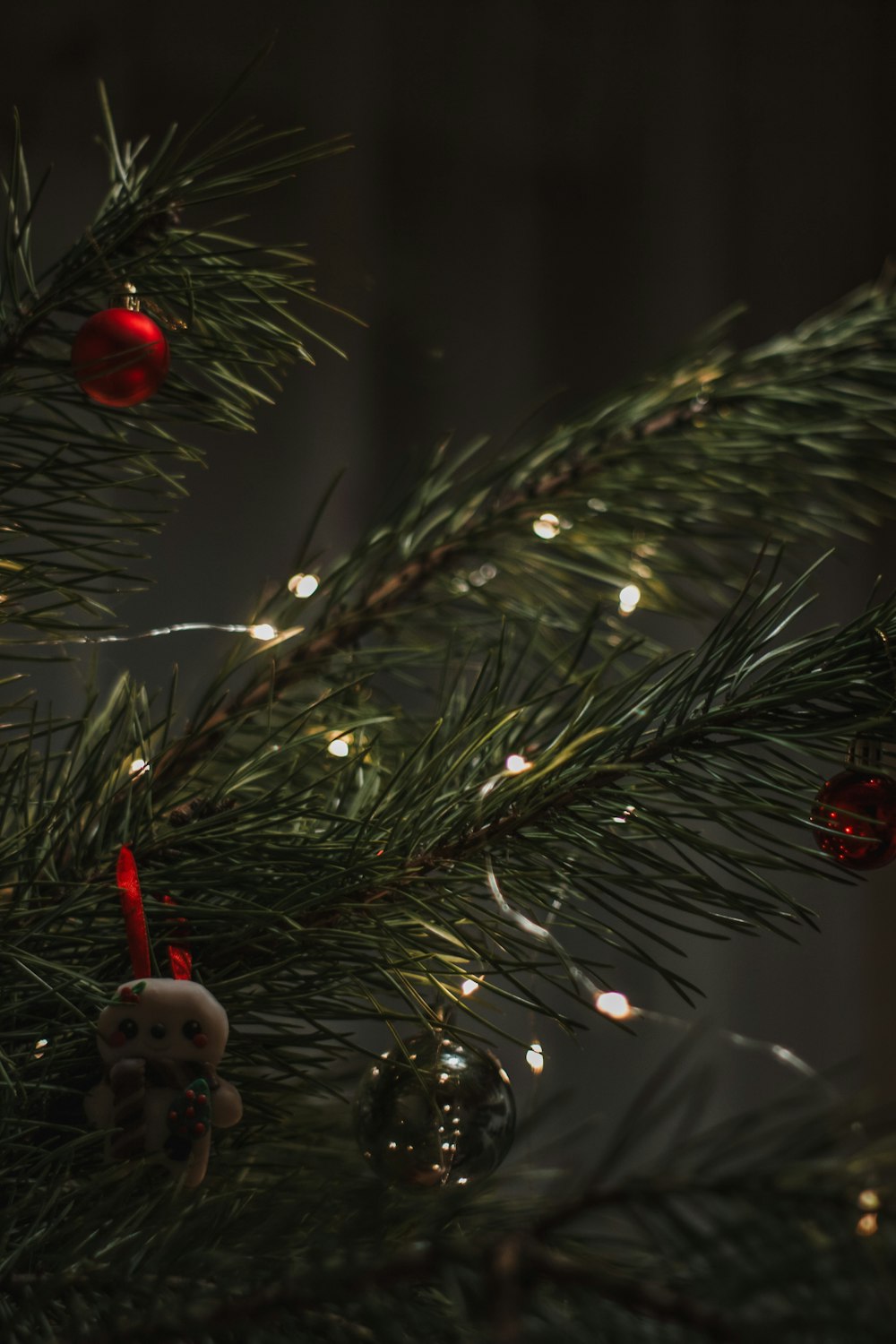 a close up of a christmas tree with ornaments