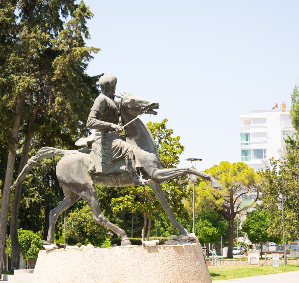 a statue of a man riding a horse